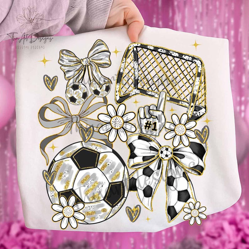 May include: A white graphic design featuring soccer-themed elements. Includes soccer balls, a goal, bows, daisies, hearts, and a #1 foam finger. Accents are gold and gray.