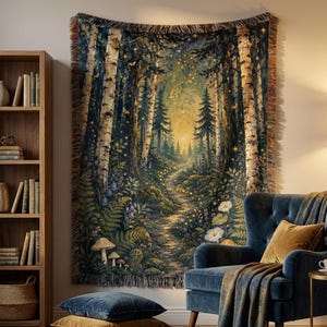 May include: A woven tapestry wall hanging featuring a forest scene with birch trees, a winding path, glowing fireflies, ferns, and mushrooms. The design includes a golden sunset light filtering through the dark trees, finished with a fringed edge.