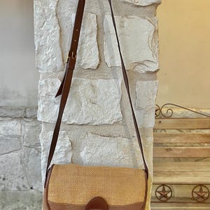 May include: A white ceramic mug with a black handle and the text "But First, Coffee" in a handwritten style. The mug is likely 4 inches tall and holds approximately 12 ounces of liquid.