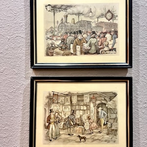 May include: A white ceramic mug with a black handle and the text "But First, Coffee" in a bold, black font. The mug is set against a blurred background, suggesting a cozy setting. The mug appears to be approximately 4 inches tall.