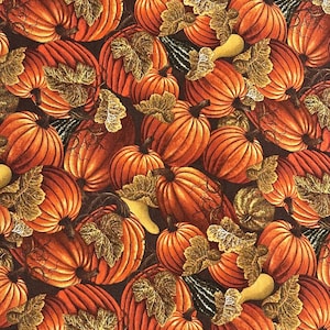 May include: A fabric pattern featuring a repeating design of orange pumpkins with green and gold leaves. The pumpkins vary in size and are set against a dark brown background, creating a fall harvest theme.