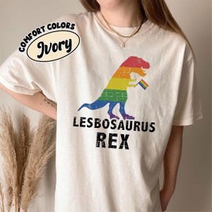 Lesbosaurus Rex Dinosaur in Rainbow Flag for Lesbian Pride Comfort Colors T-Shirt, LGBTQ+ Pride Graphic Tee