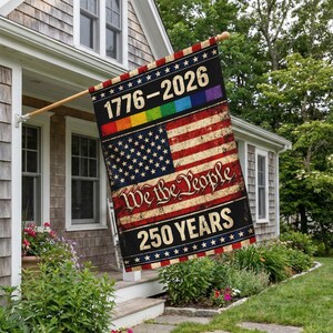 May include: A rectangular flag with the American flag design, featuring red and white stripes and a field of stars. The flag includes the text "1776-2026" above a rainbow stripe and "We the People 250 YEARS" below the flag design.