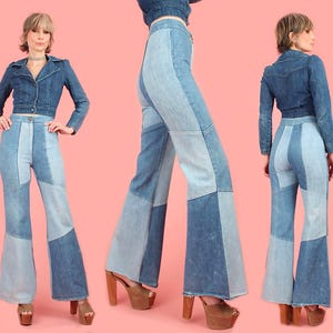 May include: Three images of a woman wearing a denim jacket and patchwork bell-bottom jeans. The jeans feature a light and dark blue colour scheme. The jacket is a cropped style. The background is a solid pink colour.