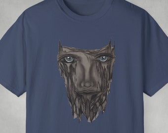 May include: A navy blue t-shirt with a graphic of a face with eyes, nose, and mouth, surrounded by a textured, cracked, and peeling design.