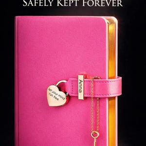 May include: A pink journal with gold-edged pages and a heart-shaped lock. The journal has the text "Her Secrets, SAFELY KEPT FOREVER" and "let your mind run free." A gold key hangs from the lock.
