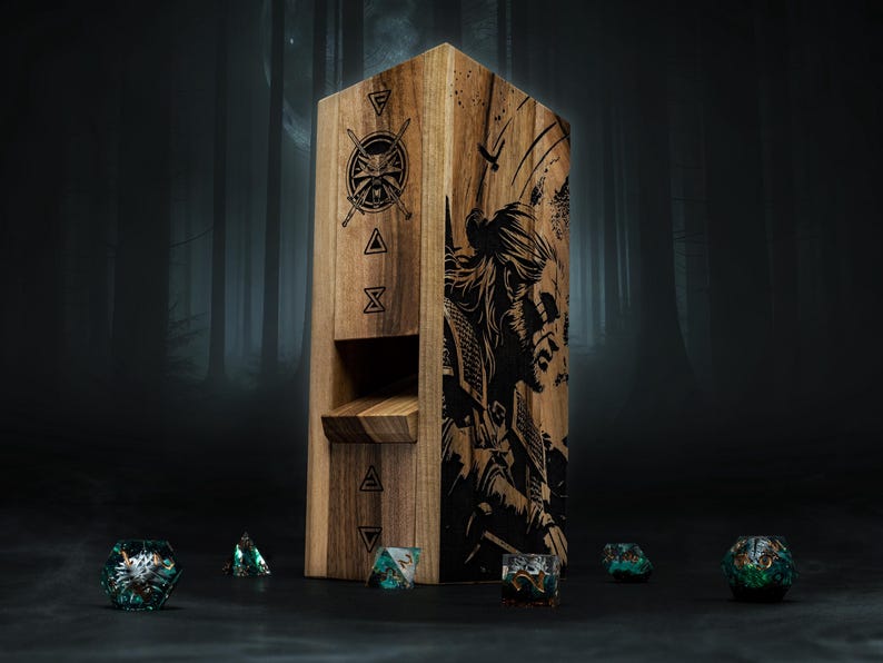 May include: Wooden dice tower featuring etched artwork of a warrior and symbols. The tower is rectangular with a slot for dice to roll through. Several colourful dice are scattered around the base of the tower.