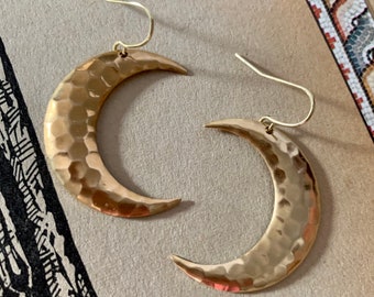 Hammered Metal Crescent Moon Earrings in gleaming gold tone brass