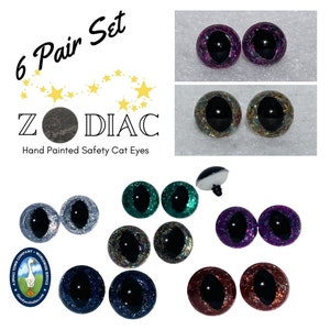 May include: A set of six pairs of hand-painted safety cat eyes for crafts. The eyes are made of plastic and have a black pupil with a glitter finish. The colours include silver, teal, gold, purple, blue, and red.