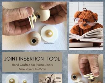 May include: A wooden tool for inserting plastic joints into stuffed toys. The tool is made of wood and has a small hole in the center. The tool is shown being used to insert a plastic joint into a stuffed toy arm. The tool is hand-crafted and is available in sizes from 20mm to 65mm.