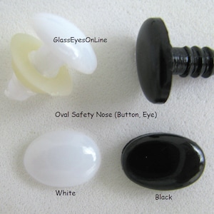 May include: Two oval safety noses for stuffed animals, one white and one black. The noses are made of plastic and have a smooth, shiny finish. GlassEyesOnline.