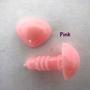May include: Pink plastic safety eyes for stuffed animals. The eyes are sold in pairs and come with a screw-on back.