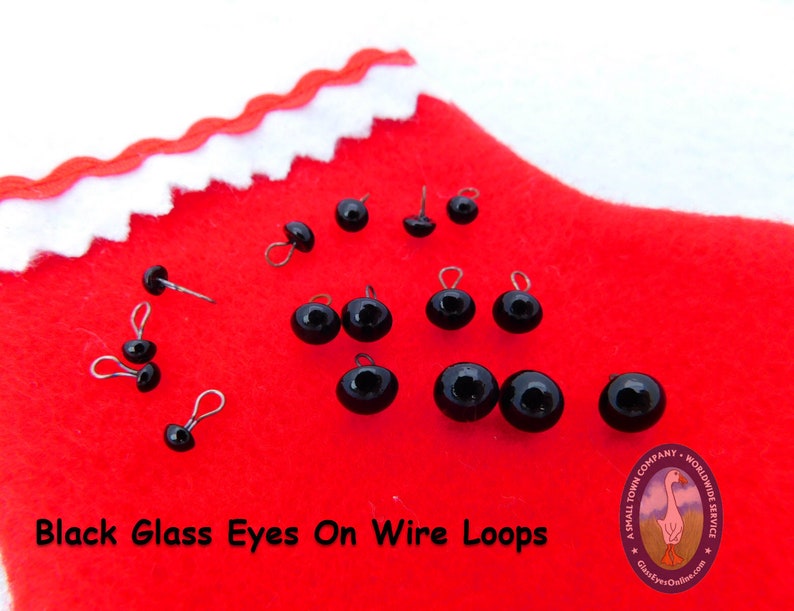 May include: Black glass eyes on wire loops. These eyes are great for crafts and projects.