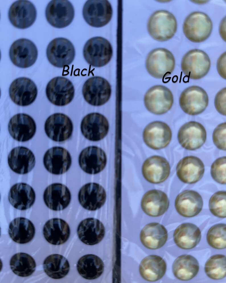 May include: Two sheets of self-adhesive googly eyes. One sheet has black eyes and the other sheet has gold eyes.