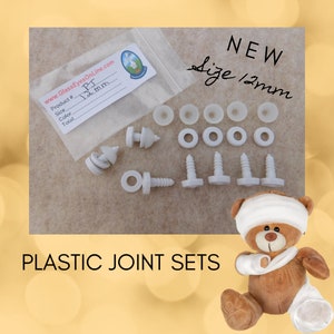 May include: A set of white plastic joint sets for creating articulated stuffed toys. The set includes 12mm screw-in joints, washers, and caps. The set is packaged in a clear plastic bag with a label that reads "Product # PJ 12mm". The label also includes the website address "www.GlassEyesOnLine.com".
