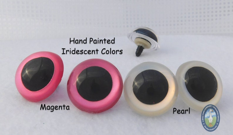 May include: Three pairs of plastic safety eyes for crafts, with black pupils and iridescent hand-painted colors: magenta, pink, and pearl.