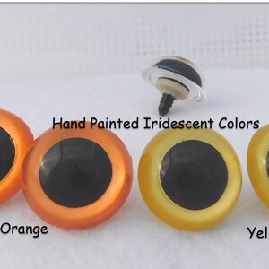 May include: Two pairs of plastic safety eyes for crafts. The eyes are iridescent and come in orange and yellow. The eyes have black pupils and are hand painted.