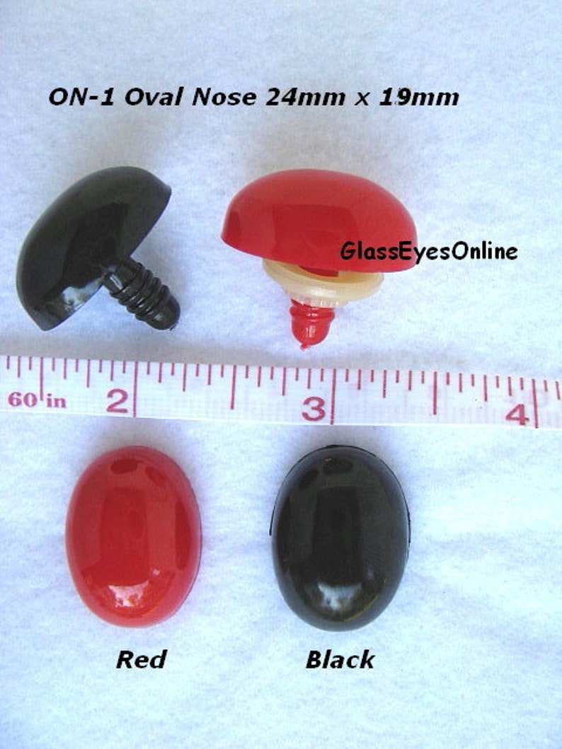 May include: Four plastic oval noses, two black and two red, with a screw-on post. The noses are 24mm x 19mm. The text "ON-1 Oval Nose 24mm x 19mm" and "GlassEyesOnline" are visible in the image.