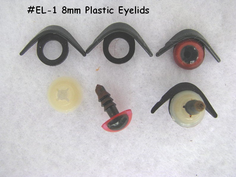 May include: Eight 8mm plastic eyelids for stuffed animals. The eyelids are black and come in pairs. There are also two plastic eyes with red and white pupils. The eyes are 8mm in diameter.