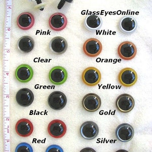 May include: Assortment of 21mm plastic safety eyes in various colours, including black, white, pink, orange, yellow, green, red, blue, brown, silver, and gold. PE-1 Plastic Safety Eyes - 21mm. GlassEyesOnline.