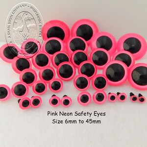 May include: Assortment of pink neon safety eyes in various sizes, ranging from 6mm to 45mm. The eyes have black pupils and are ideal for crafting projects.