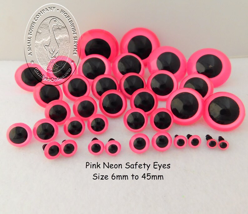 May include: Assortment of pink neon safety eyes in various sizes, ranging from 6mm to 45mm. The eyes have black pupils and are ideal for crafting projects.