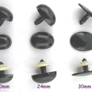 May include: Assortment of black plastic safety eyes for stuffed animals in three sizes: 20mm, 24mm, and 30mm. The eyes have a flat back and a post for attaching to fabric.
