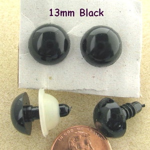May include: Two black plastic eyes with a 13mm diameter, and two black plastic eyes with a screw back, also 13mm in diameter.