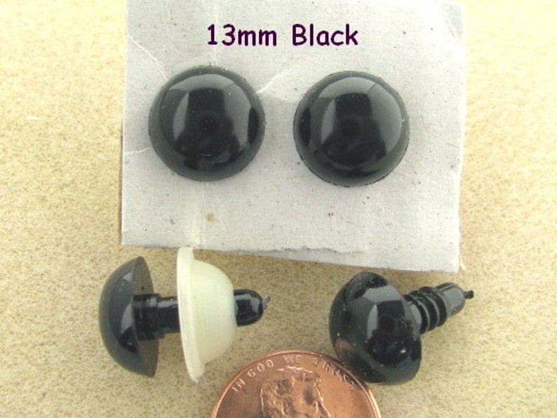 May include: Two black plastic eyes with a 13mm diameter, and two black plastic eyes with a screw back, also 13mm in diameter.
