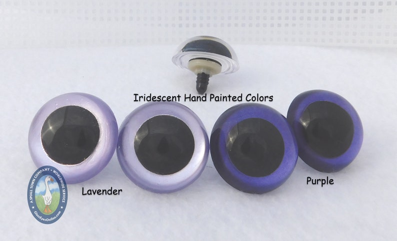 May include: Three pairs of iridescent plastic safety eyes for crafts. The eyes are hand-painted in lavender, light purple, and purple.  The eyes have black pupils.