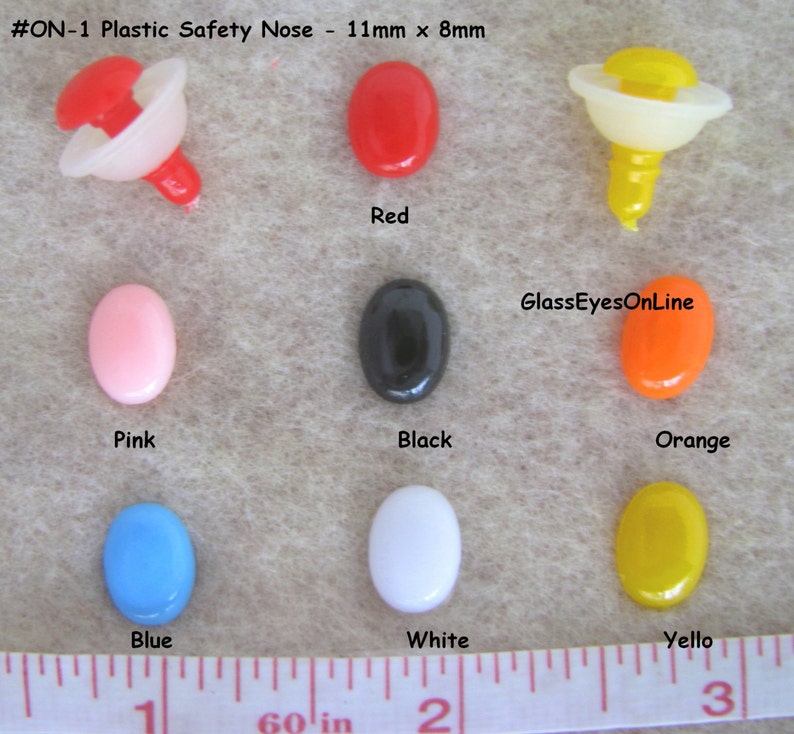 May include: Assortment of plastic safety noses in various colors, including red, pink, black, orange, blue, white, and yellow. The noses are 11mm x 8mm in size. #ON-1 Plastic Safety Nose - 11mm x 8mm