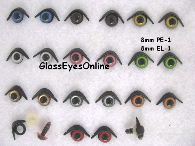 Puede incluir: Surtido de ojos de seguridad de pl&aacute;stico de 8 mm en varios colores, incluyendo negro, azul, verde, dorado, plateado, rojo y marr&oacute;n. Los ojos est&aacute;n dise&ntilde;ados para su uso en proyectos de manualidades, como animales de peluche y mu&ntilde;ecas. La imagen tambi&eacute;n incluye un primer plano de un solo ojo con una parte posterior de tornillo.