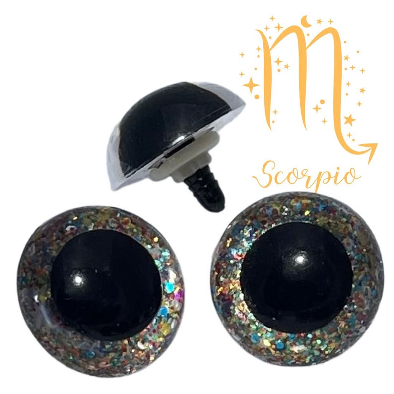 May include: Two black and silver glitter safety eyes with a silver screw back. The eyes are surrounded by a colorful glitter ring. The image also includes a silver screw back safety eye.