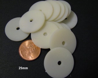 May include: A stack of 10 white plastic washers with a 25mm diameter and a central hole. A penny is included for scale.