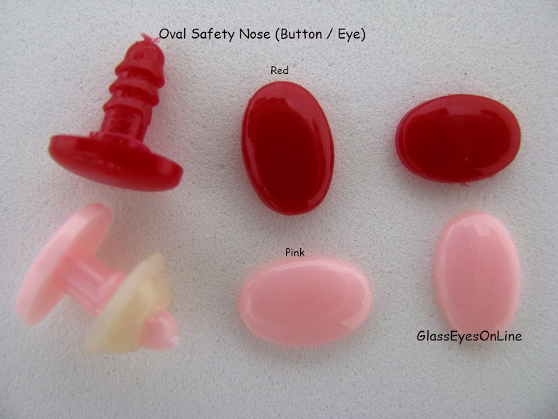 May include: Oval safety nose buttons in red and pink. The buttons have a flat back and a post on the front. The buttons are used for making stuffed animals.