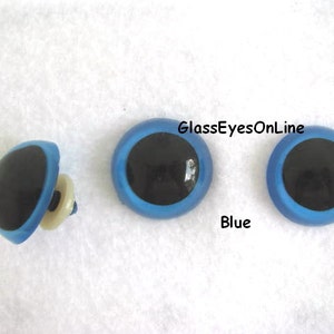 May include: Three blue plastic safety eyes with black pupils. The eyes are 1 inch in diameter. GlassEyesOnLine is printed on the image.