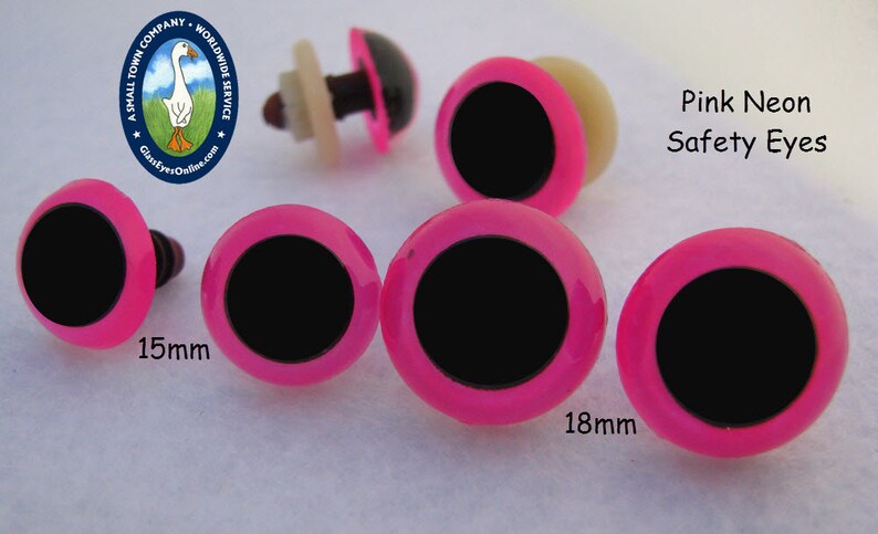 May include: Pink neon safety eyes for crafts, 15mm and 18mm in size.  The eyes have a black pupil and a pink rim.