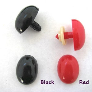 May include: Four plastic safety eyes for crafts. Two black round eyes, one black dome-shaped eye with a screw post, and one red dome-shaped eye with a screw post. The eyes are labeled "Black" and "Red".