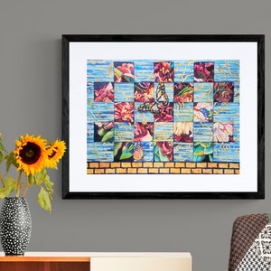 May include: A framed watercolor painting of a butterfly and flowers in a grid pattern. The painting is in shades of blue, green, red, and yellow. The frame is black.