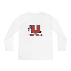 May include: White long-sleeve shirt with a red and black "U" logo and the word "FOOTBALL" in red. The logo features a stylized "U" with a feather design. The shirt is a crew neck style.