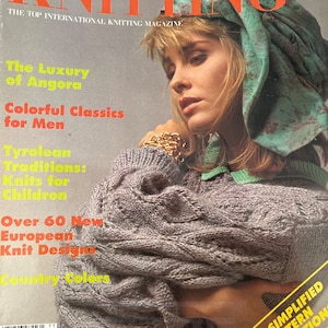 May include: A magazine cover for Stylish Knitting, featuring a woman wearing a light gray knitted sweater and a turquoise scarf with floral print. The magazine cover text reads "The Luxury of Angora", "Colorful Classics for Men", "Tyrolean Traditions: Knits for Children", "Over 60 New European Knit Designs", and "Country Colors".