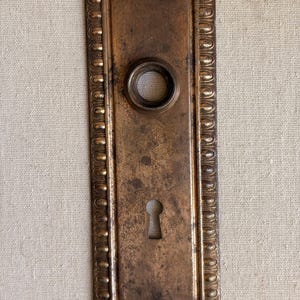 May include: A set of three ceramic mugs with a speckled, matte finish. The mugs are in shades of cream, light gray, and dark gray. Each mug has a simple, minimalist design, perfect for coffee or tea.