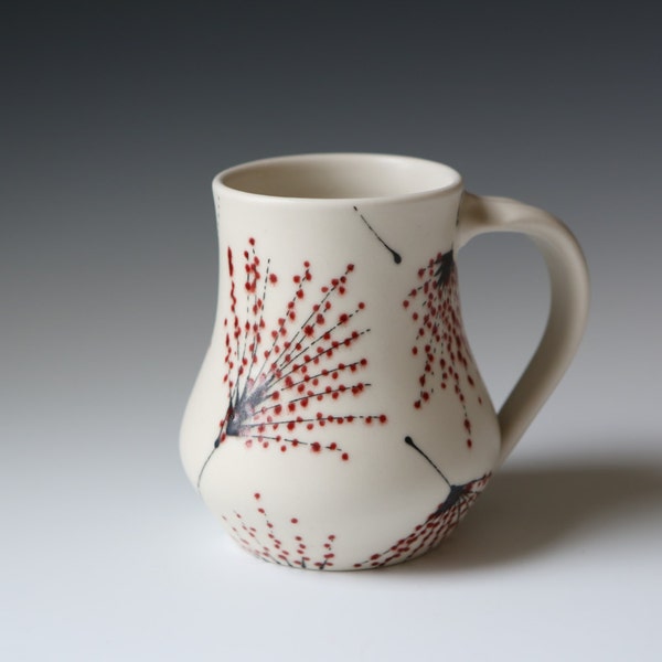 Porcelain mug with red and black thistle