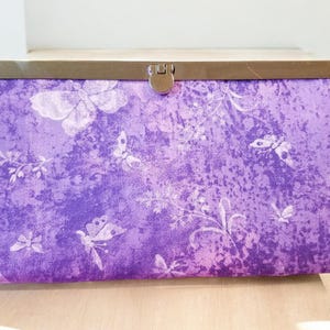Cartera de mano Diva con diseño de mariposa