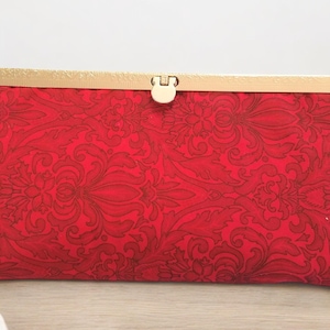 Cartera de mano Diva con diseño de pergamino rojo para vacaciones