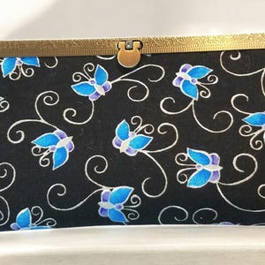 Cartera de mano Diva con mariposa azul