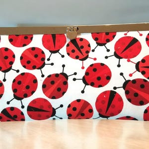 Cartera de mano Diva con diseño de mariquita