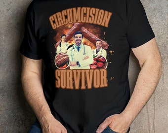 May include: A black t-shirt with the text "Circumcision Survivor" in brown letters. The design features a man in a white doctor's coat with a stethoscope around his neck, surrounded by images of sausages.