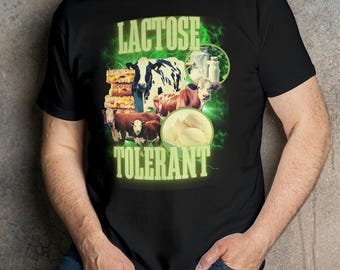 May include: A black t-shirt with a green graphic design that says "Lactose Tolerant". The graphic features cows, milk cartons, and cheese.