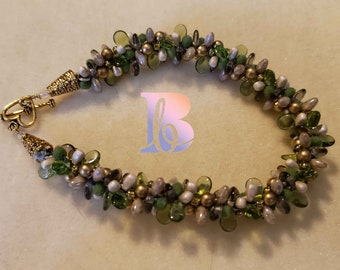 10" shades of green beaded kumihimo bracelet with toggle closure
